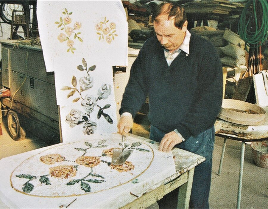 Creating decorative ornament on a pre-cast tile. 

Archival photograph, c.1980’s, Copyright: public domain.