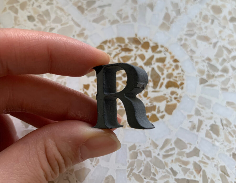 Letter 'R' insert, cut from stone