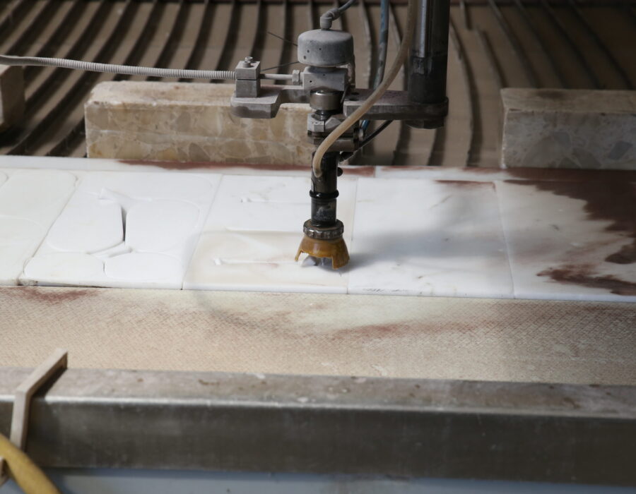 Water-jet cutter cutting marble inserts